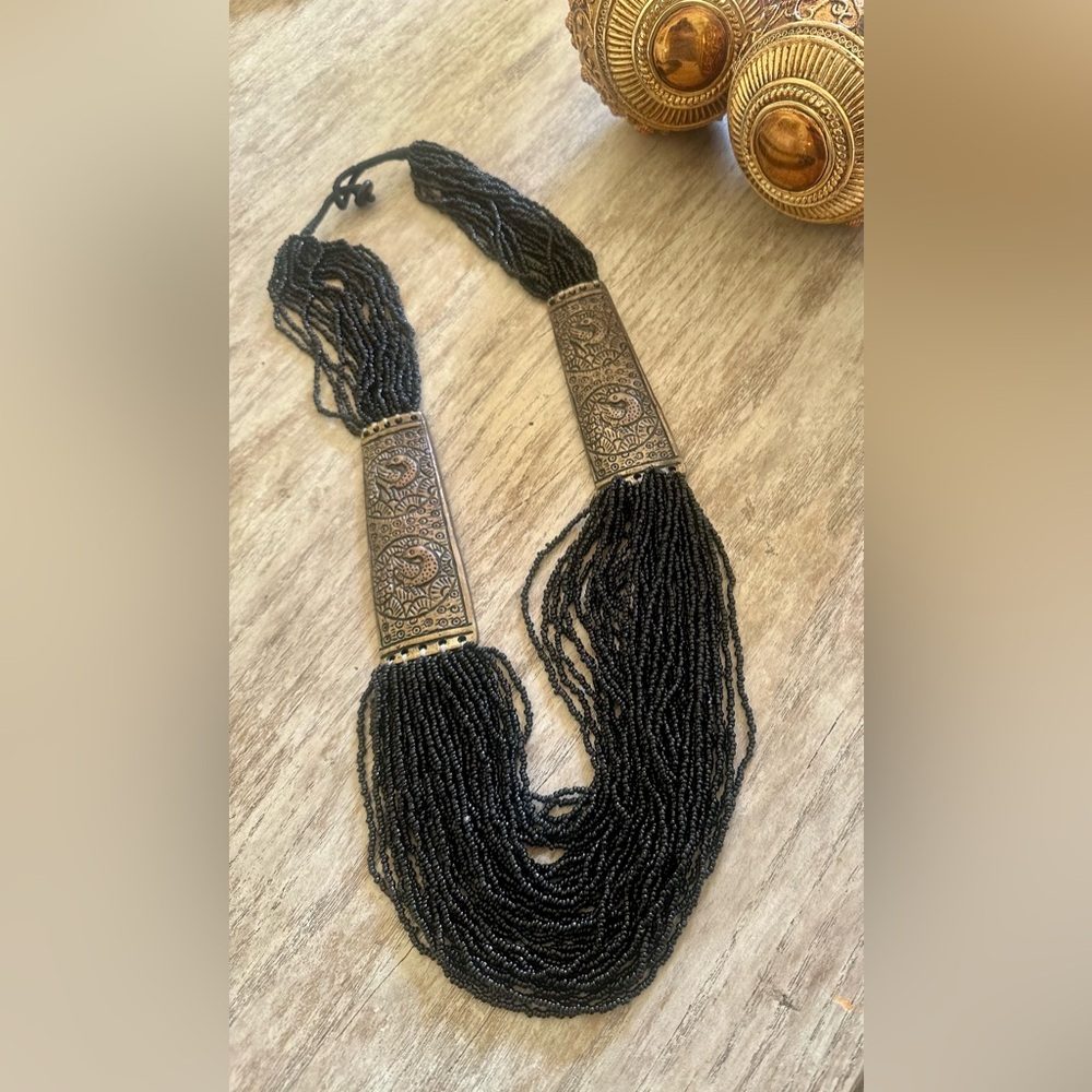 Black Beaded Necklace with Ornate Gold Accents